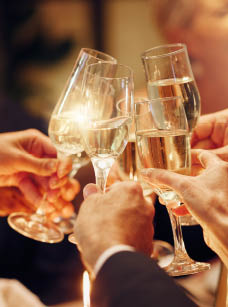 Success, hands or toast in a party for goals, winning deal or new year at luxury social event celebration. Motivation, team work or people cheers with champagne drinks or wine glasses at dinner gala.